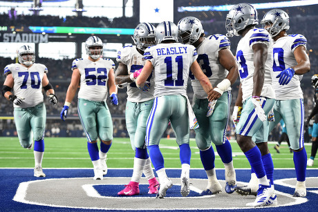 Arlington, Texas, USA. 14th Oct, 2018. Jacksonville Jaguars cornerback  Tyler Patmon (23) tries to tackle Dallas Cowboys wide receiver Cole Beasley  (11) during the first half of the NFL football game between