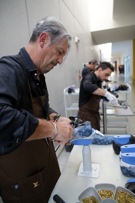 A footwear technician of the Atelier Manufacture de souliers Louis Vuitton  in Fiesso d Artico
