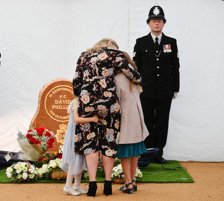 Jennifer Phillips . Pic Bruce Adams / Copy Hull - 12/10/17 Wife Jennifer Phillips With Daughters Abigail And Sophie Lay Flowers At A New Memorial To Pc David Phillips Of Merseyside Police As It Is Unveiled At Hamilton Square Gardens Birkenhead Mersey