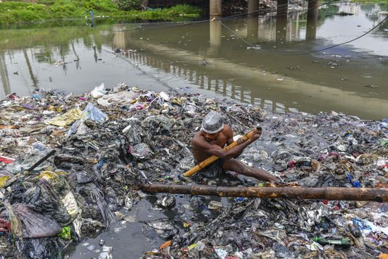 VOLUNTEERS CLEAN RIVERBANKS SURROUNDING CANAL BEFORE Editorial 