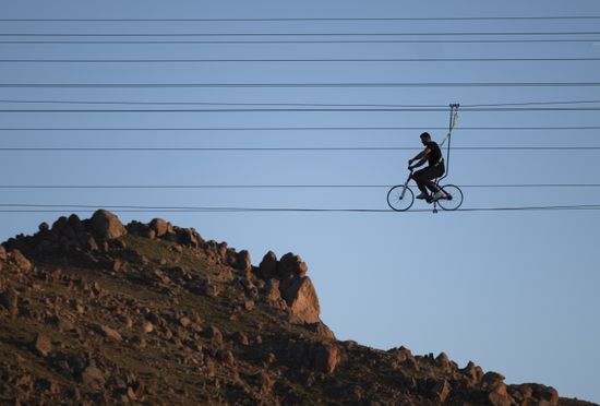 Iranian Man Rides Bicycle Along Cable Editorial Stock Photo - Stock ...