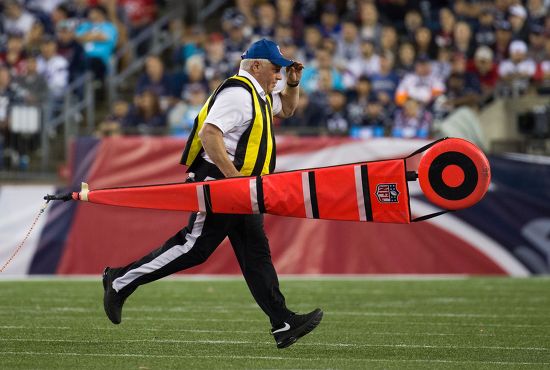 Chain Gang Person Runs Off Field Editorial Stock Photo - Stock Image