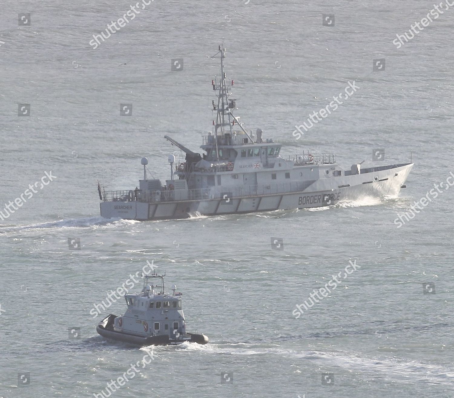 Border force boat searcher followed by editorial stock photo stock