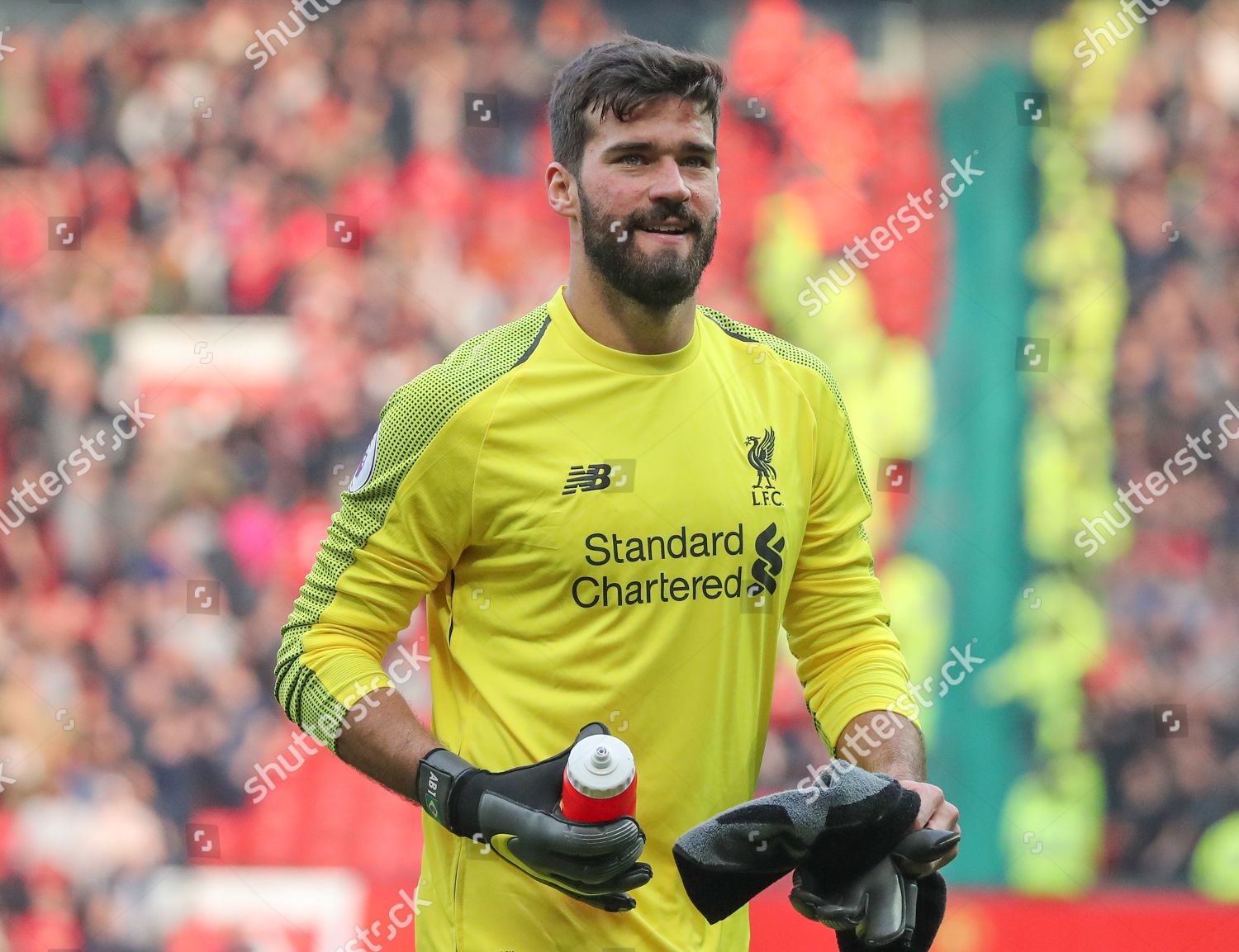 Download Alisson Becker Yellow Background Wallpaper