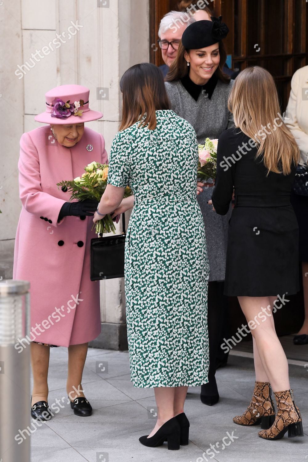 queen-elizabeth-ii-and-catherine-duchess-of-cambridge-visit-kings-college-to-open-bush-house-london-uk-shutterstock-editorial-10159785au.jpg
