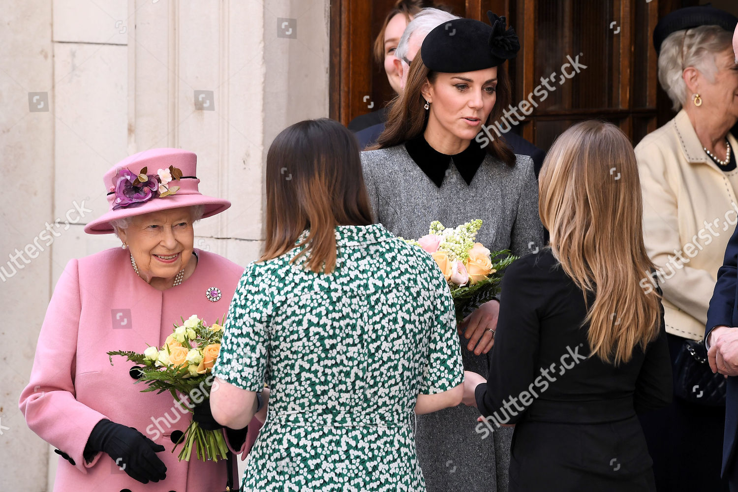 queen-elizabeth-ii-and-catherine-duchess-of-cambridge-visit-kings-college-to-open-bush-house-london-uk-shutterstock-editorial-10159785be.jpg