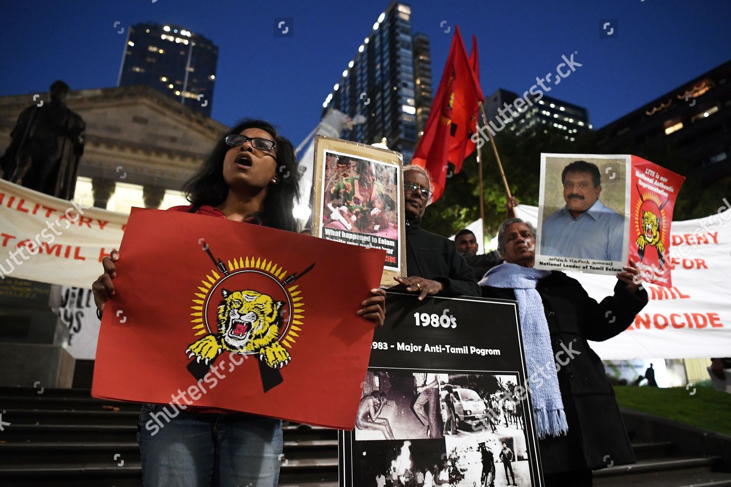 Protesters Hold Banners Flags During Demonstration Outside