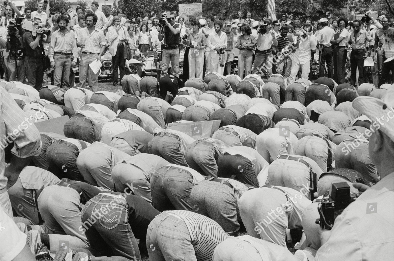 iranian-men-bow-prayer-during-demonstration-editorial-stock-photo