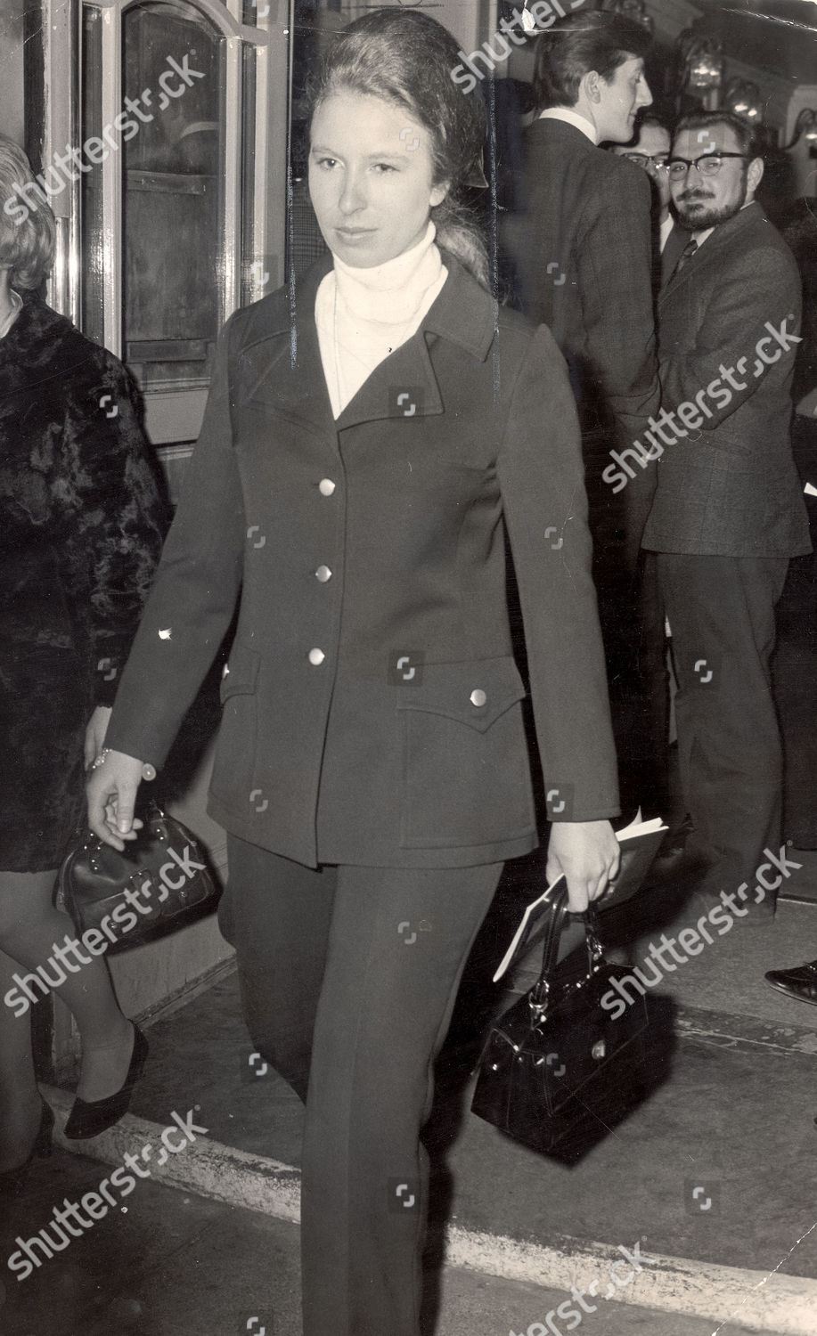 princess-anne-now-princess-royal-april-1969-princess-anne-is-seen-leaving-the-shaftesbury-theatre-after-she-danced-on-the-stage-with-other-members-of-the-audience-at-the-end-of-the-hippy-musical-hair-shutterstock-editorial-1030268a.jpg