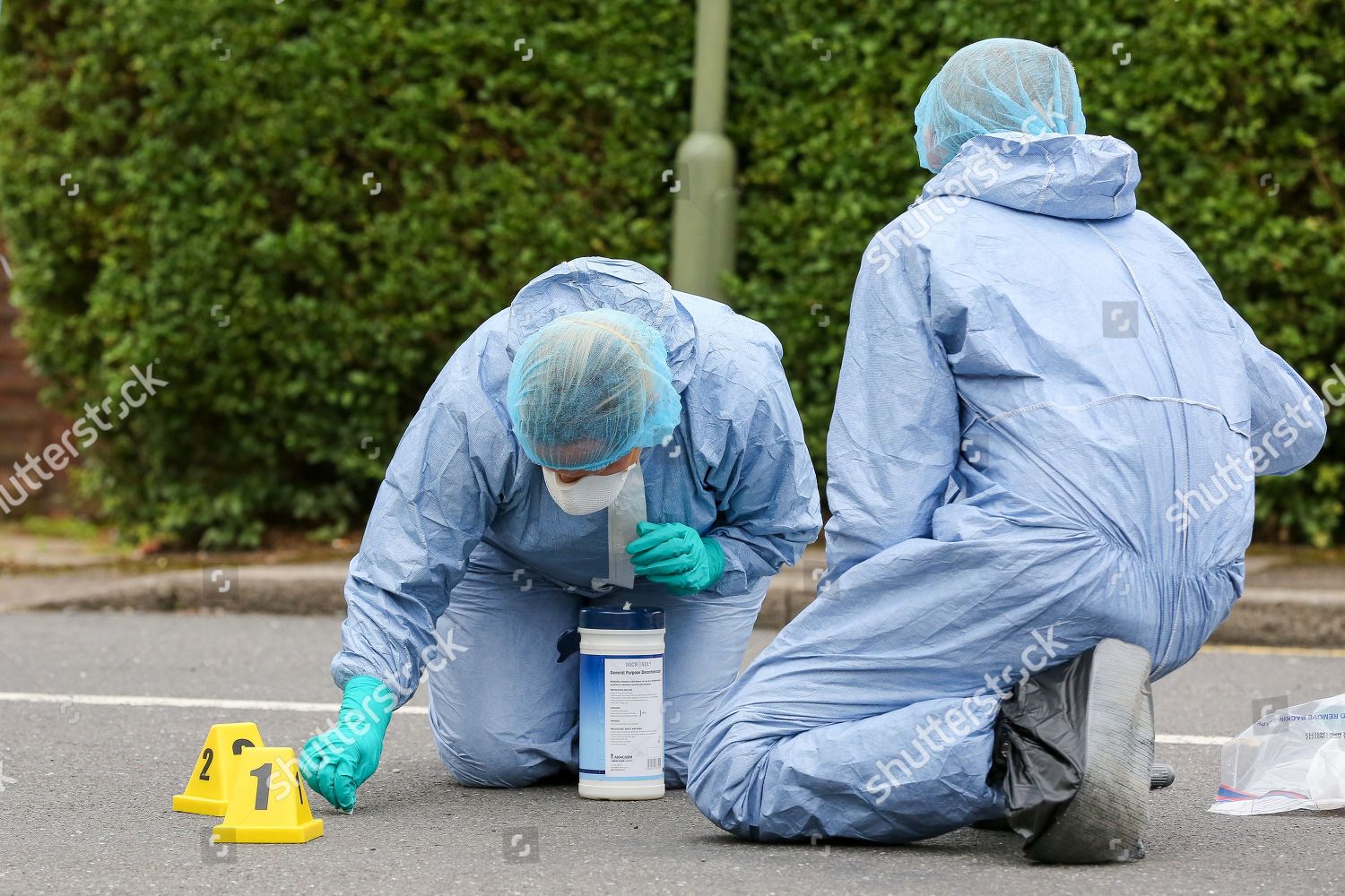 forensic-officers-next-evidence-markers-on-editorial-stock-photo