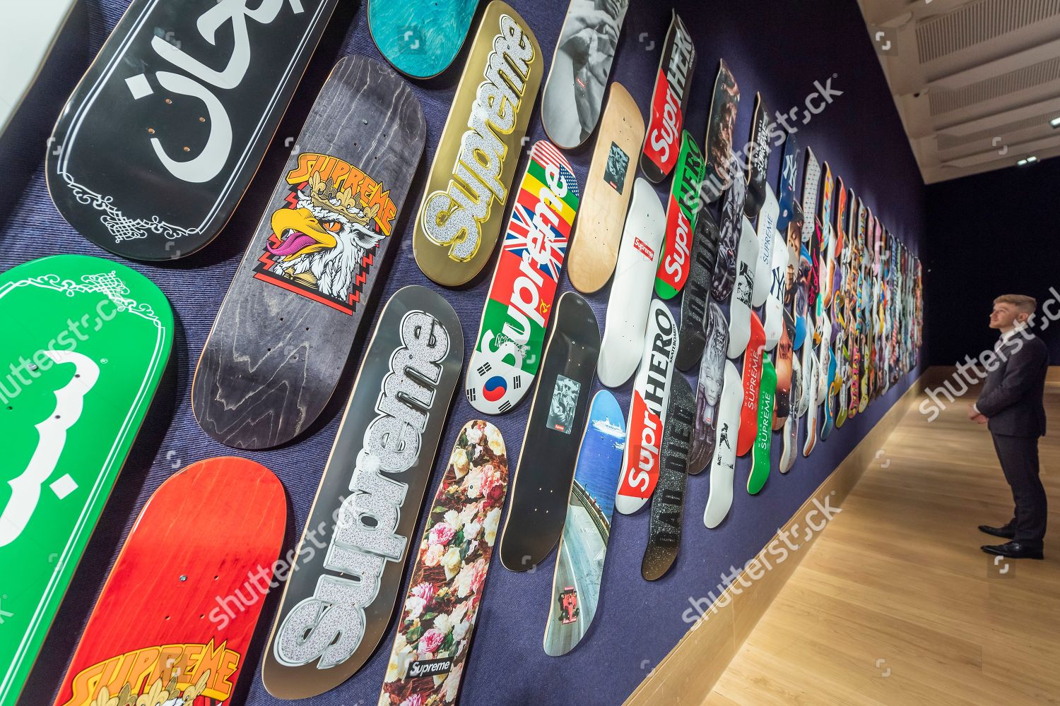 Supreme skateboard hotsell on wall