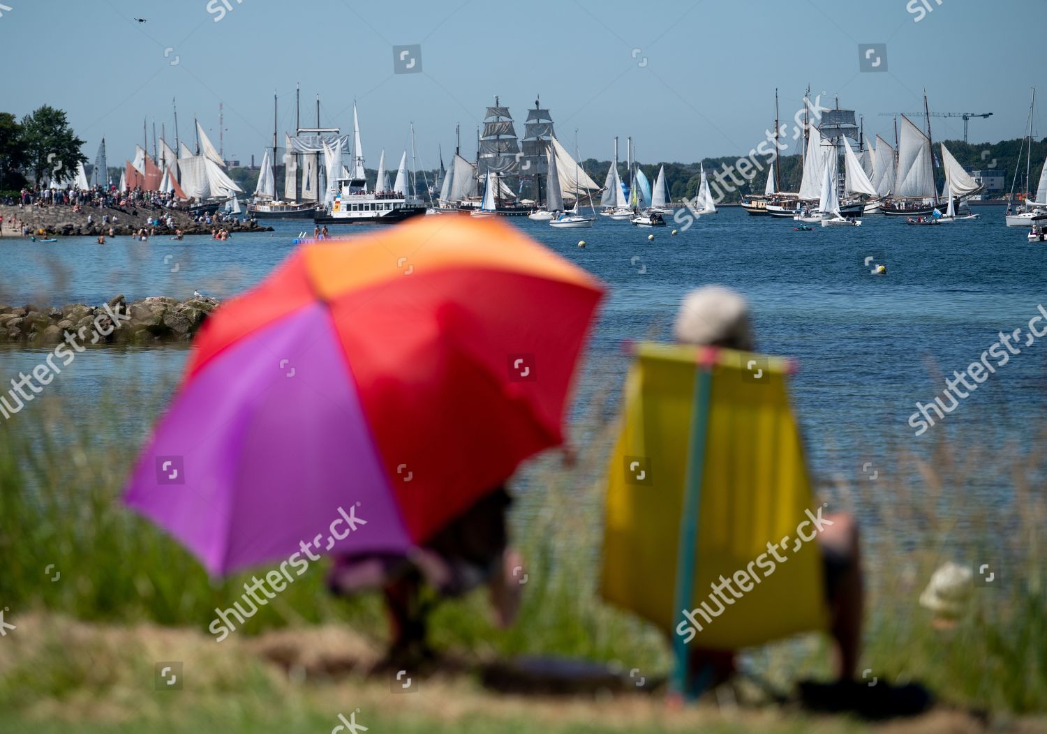People Observe Traditional Sailing Ships During Windjammer