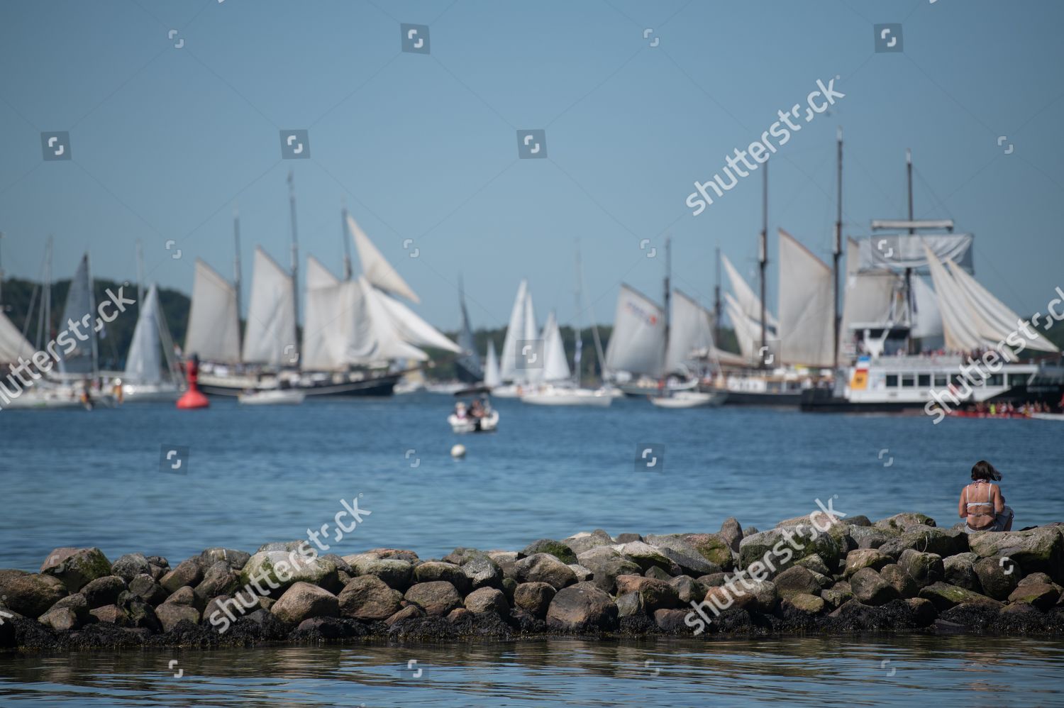 Woman Observe Traditional Sailing Ships During Windjammer