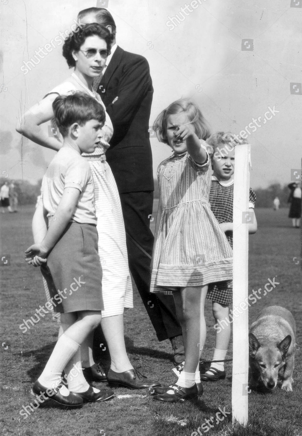 queen-elizabeth-ii-pets-picture-shows-the-queen-with-young-prince-charles-now-prince-of-wales-and-princess-anne-now-princess-royal-right-and-a-corgi-marylin-wills-2nd-right-is-the-name-of-the-princesss-friend-shutterstock-editorial-1032959a.jpg