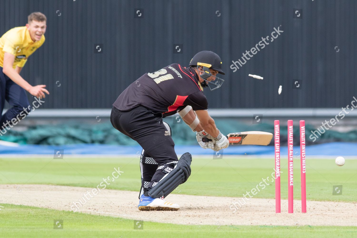 WICKET Chris Wright bowled by Henry Brooks Editorial Stock Photo ...