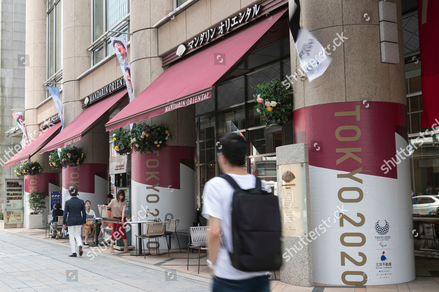 Pedestrians Walk Past Olympic Emblems Promote 2020 Editorial Stock