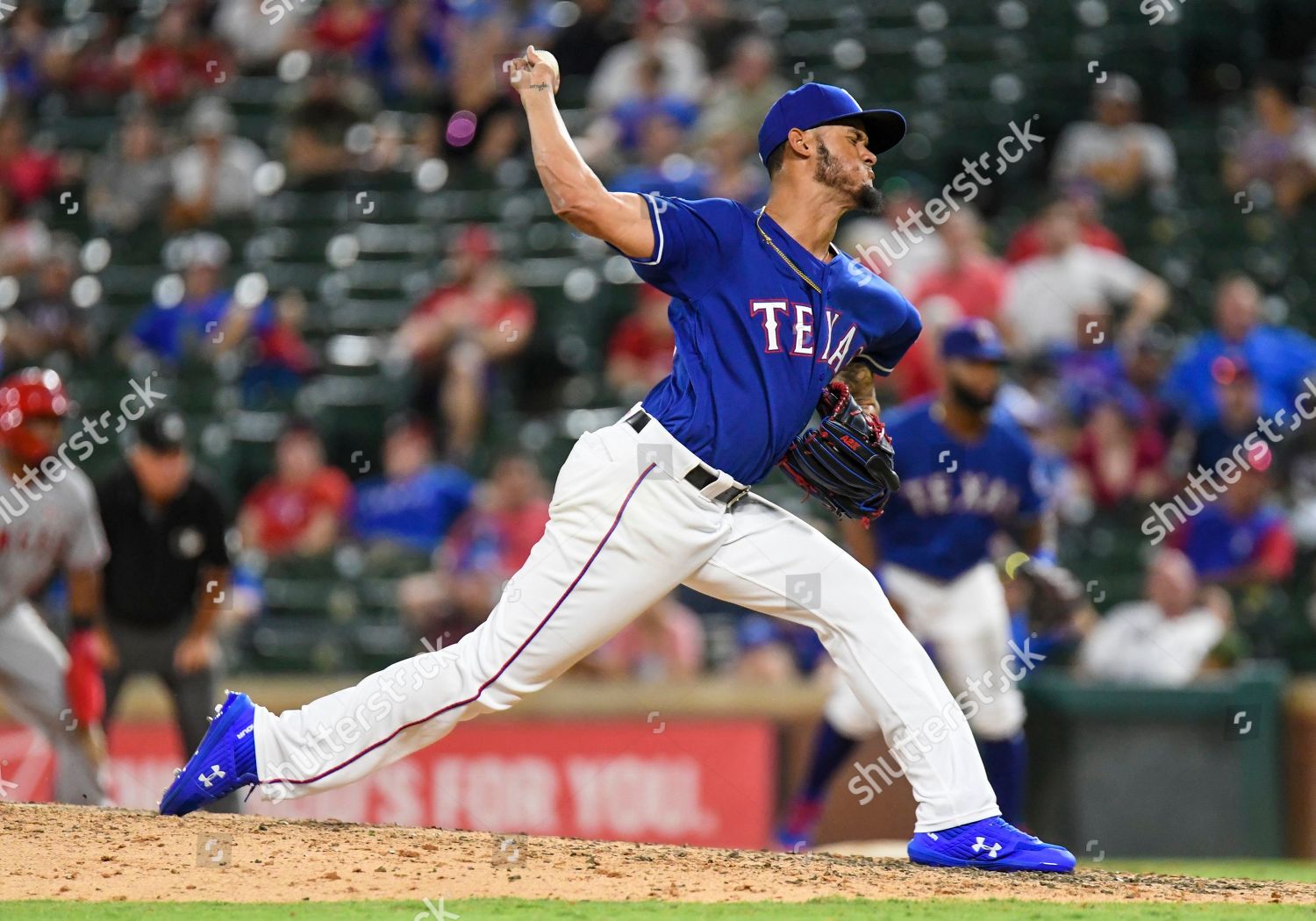 Texas Rangers relief pitcher Jonathan Hernandez walks off after