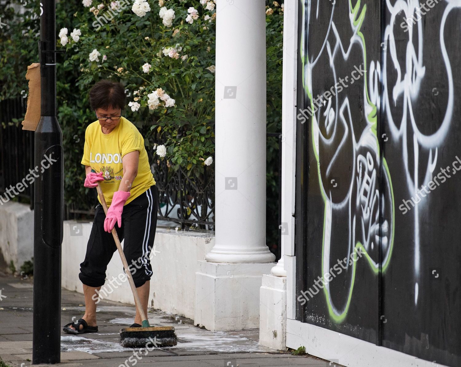 Woman Cleans Dirt Rubbish Front Door Her Editorial Stock