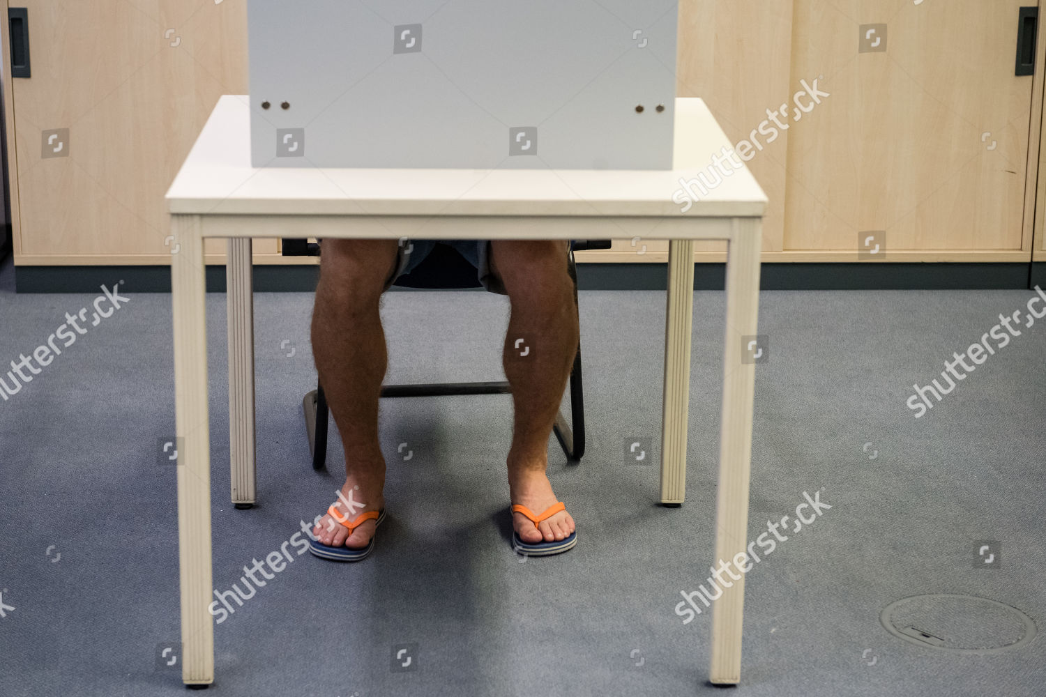 Man Wearing Flipflop Sits Polling Booth During Editorial Stock