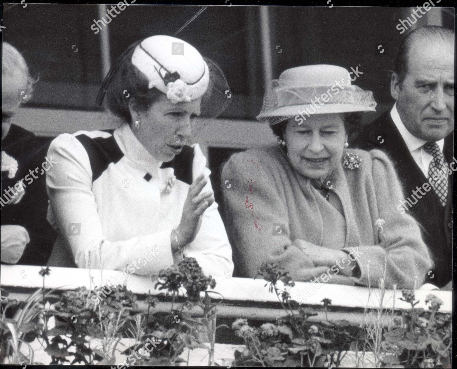 royal-family-racing-at-epsom-1985-queen-and-princess-anne-in-the-stand-before-the-derby-lord-porchester-dead-2001-on-the-right-shutterstock-editorial-1042771a.jpg
