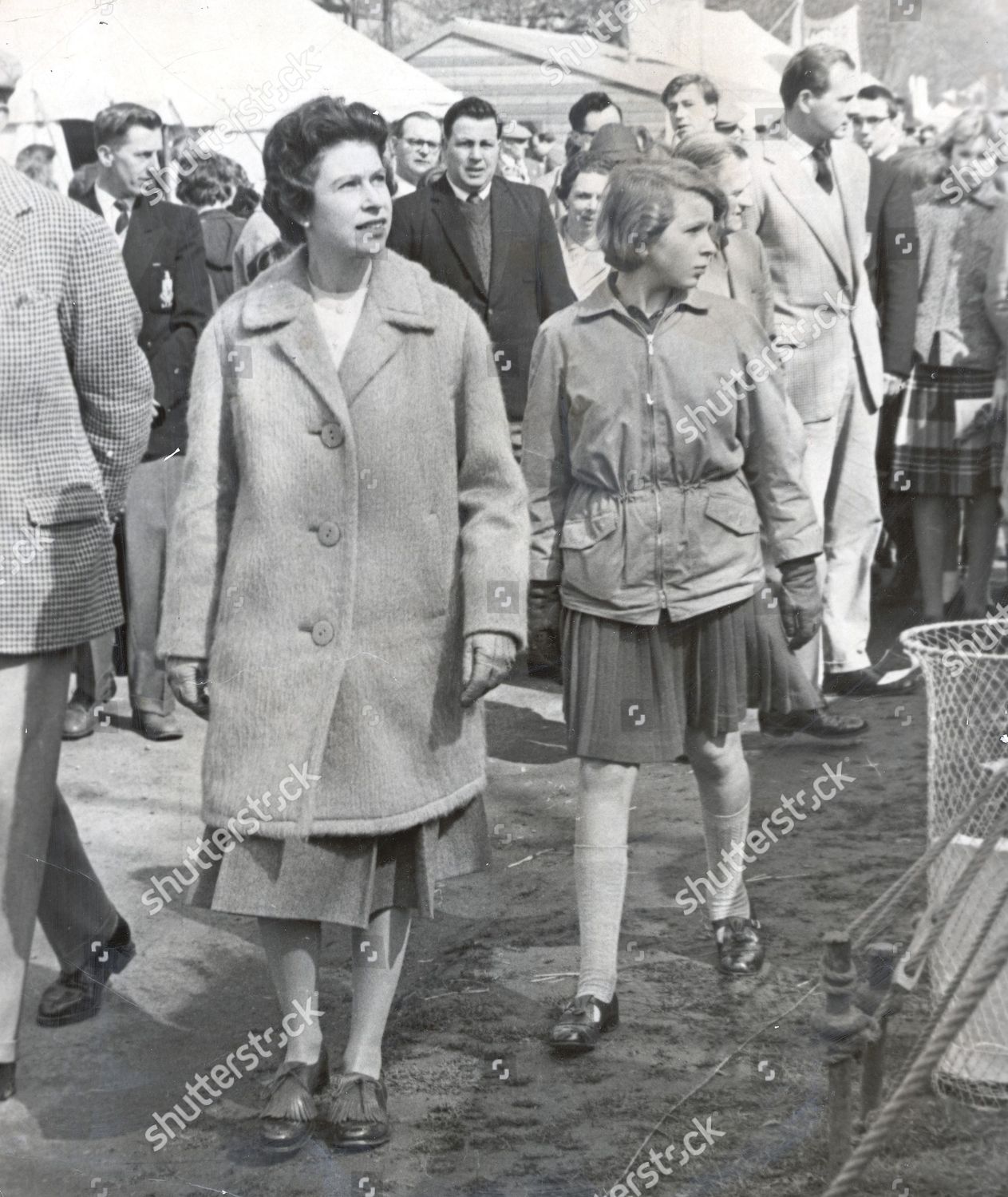 queen-elizabeth-ii-and-princess-anne-walk-around-the-tents-at-the-badminton-horse-trials-where-they-were-guests-of-the-duke-of-beaufort-1962-shutterstock-editorial-1045630a.jpg
