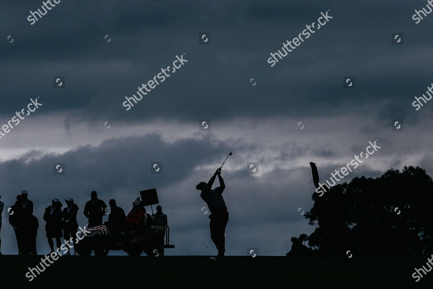 Justin Thomas Silhouetted Hits Approach Shot On Editorial Stock