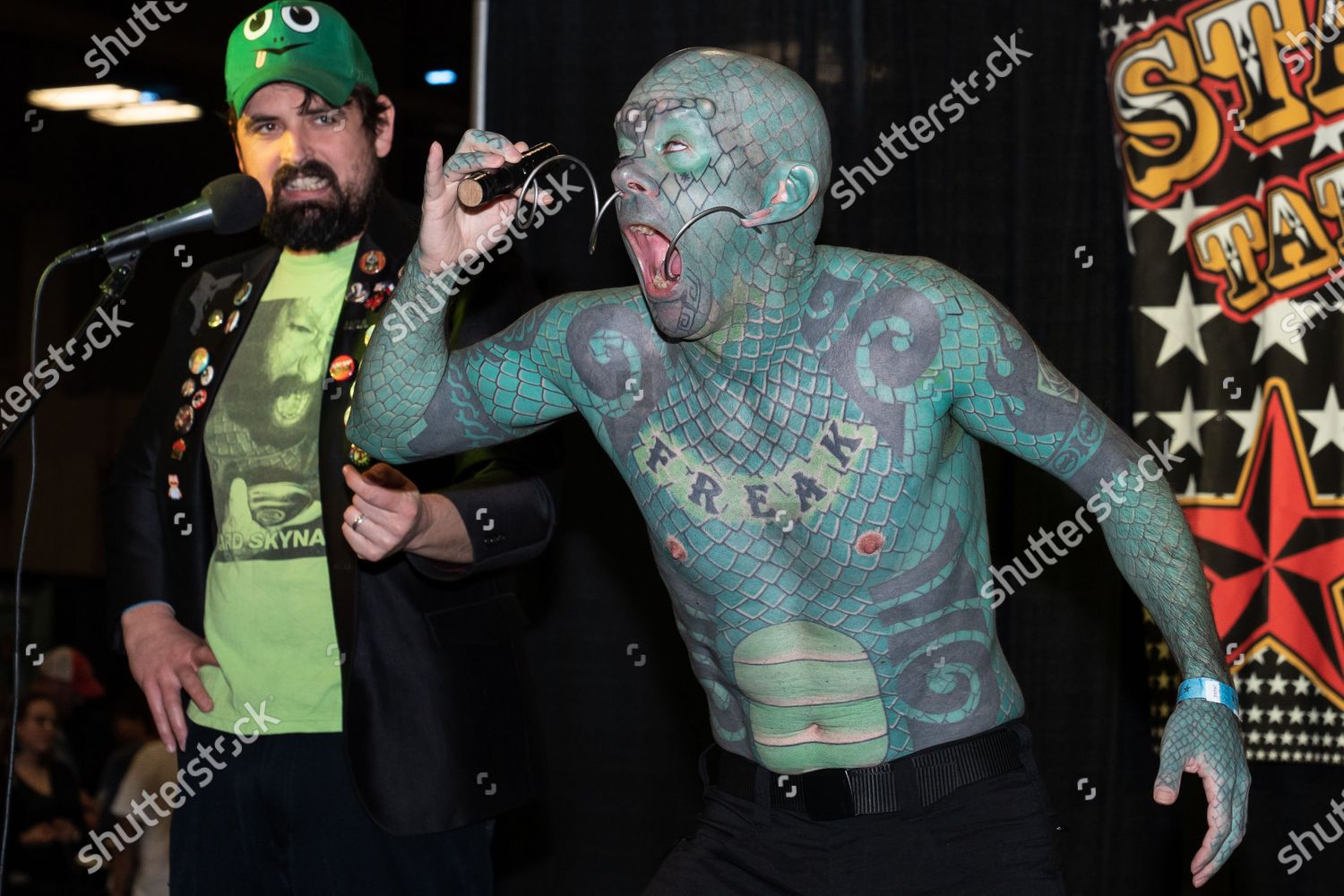 10. Eric Sprague, also known as "The Lizardman", has a full-body tattoo of green scales and has had his teeth filed into sharp points. - wide 3