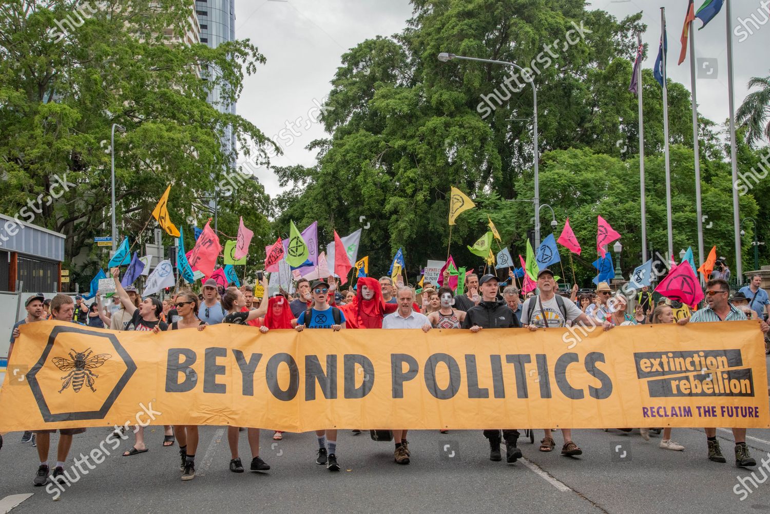 Protesters Hold Banner While Waving Flags During Editorial Stock