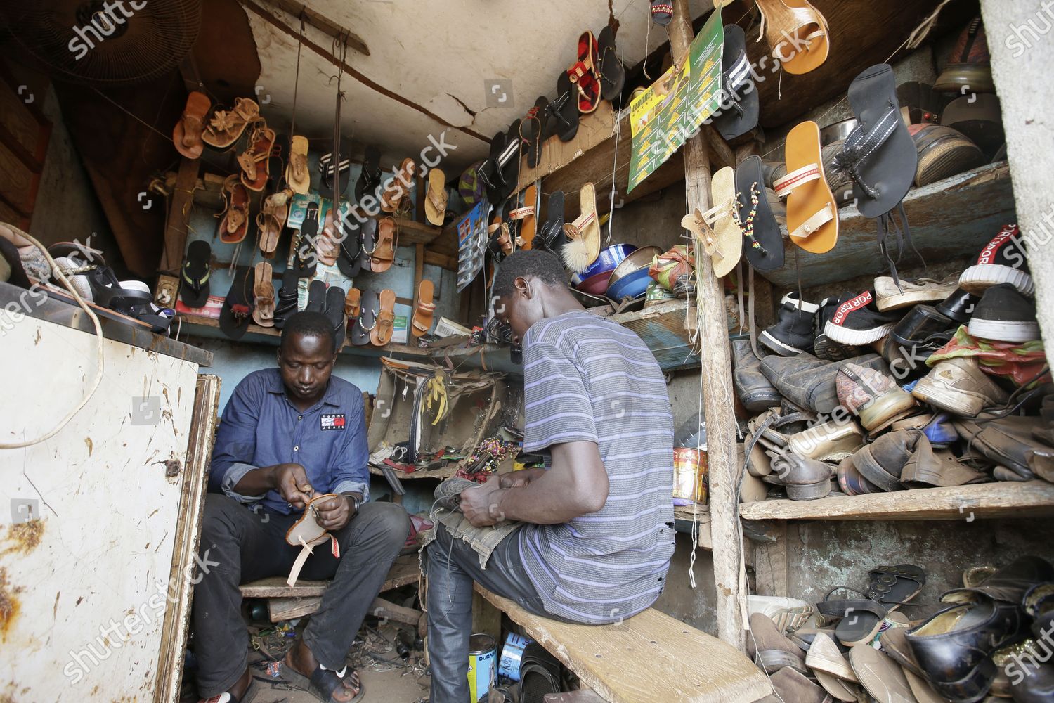 Local shoe maker repairer Ousman Keita 