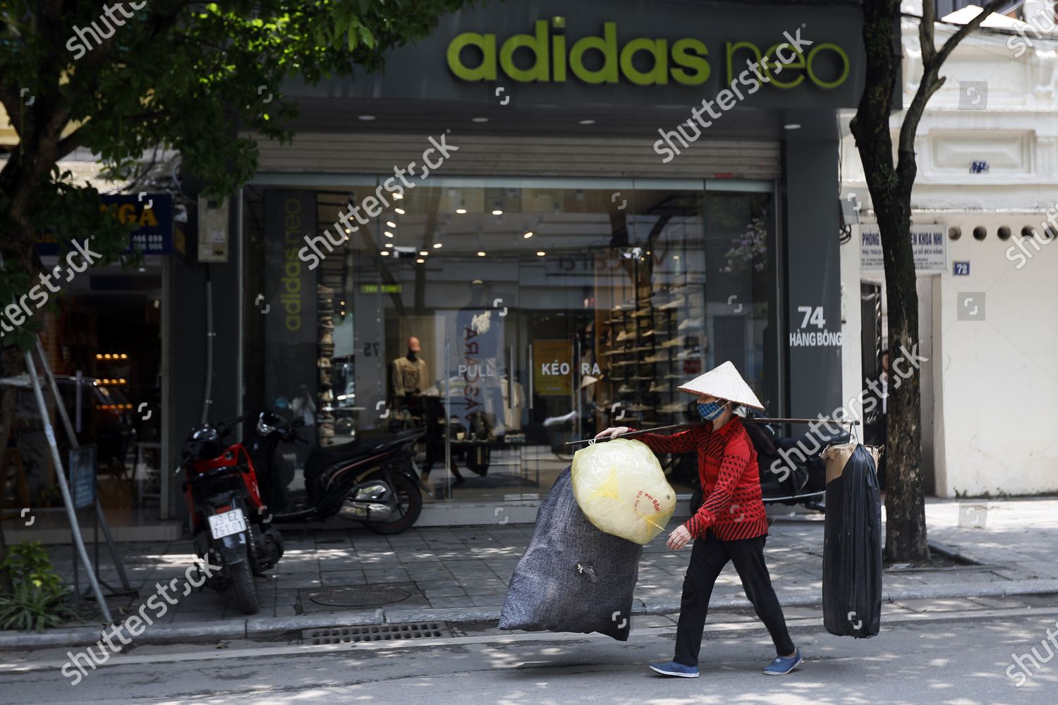 street vendor walks past Adidas store Hanoi Editorial Stock Photo - Stock  Image | Shutterstock