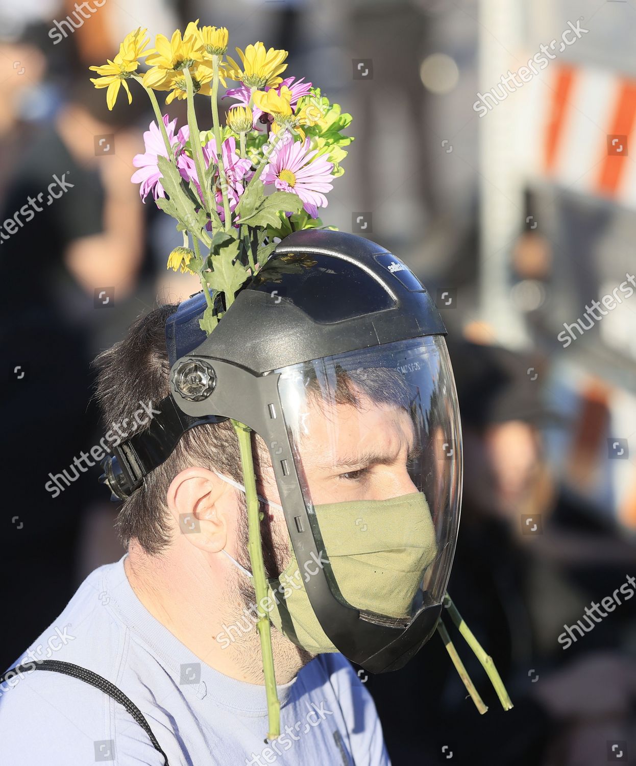 protester wears flowers his helmet during fifth Editorial Stock Photo - Image | Shutterstock