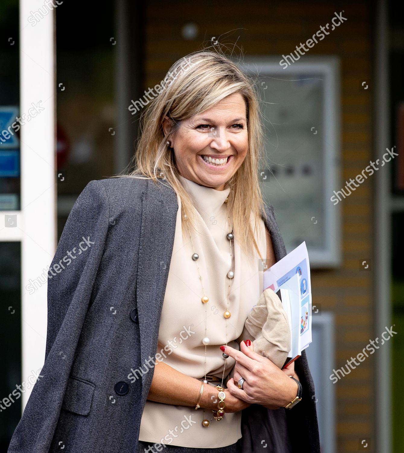 queen-maxima-visit-to-the-parnassia-group-the-hague-the-netherlands-shutterstock-editorial-10675389w.jpg