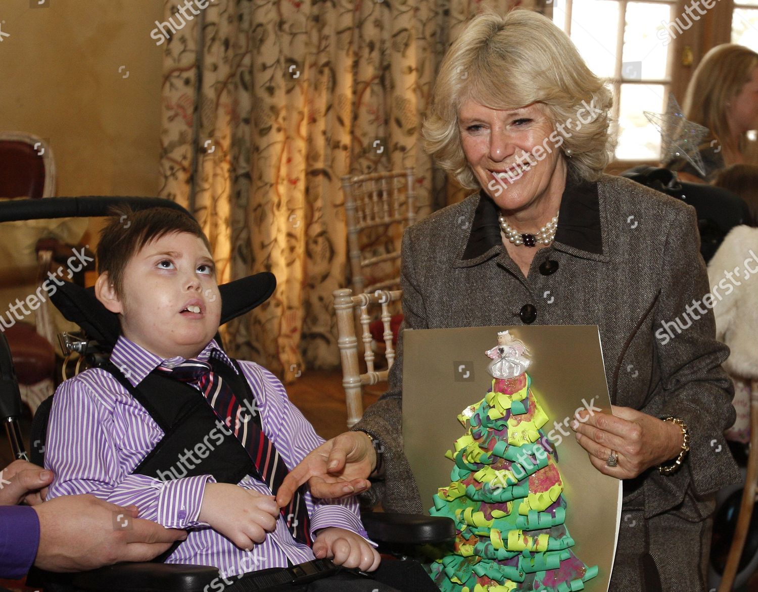 camilla-duchess-of-cornwall-meets-children-from-ty-hafan-hospice-at-highgrove-house-in-gloucestershire-britain-shutterstock-editorial-1068503c.jpg