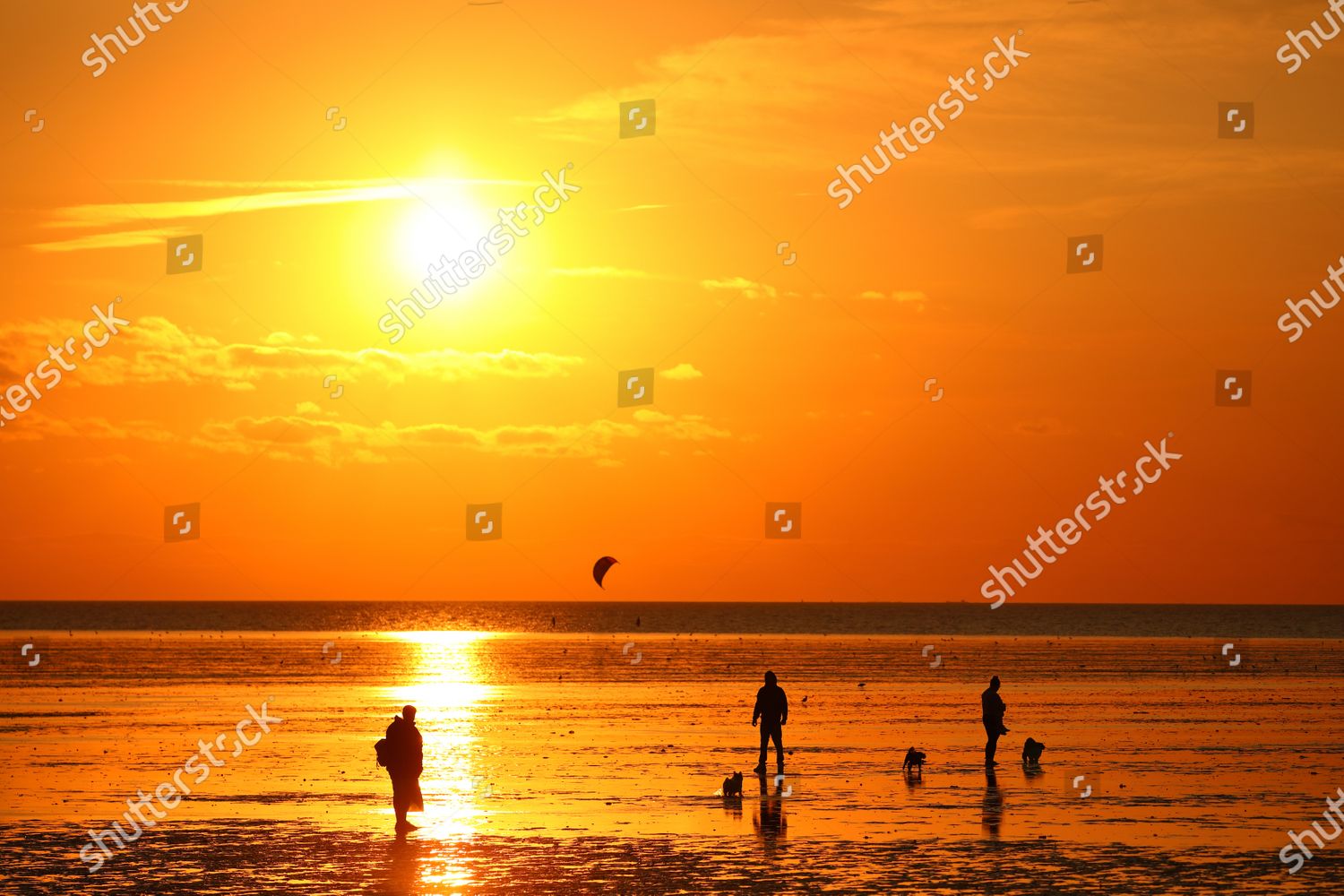 people-on-beach-low-tide-on-editorial-stock-photo-stock-image