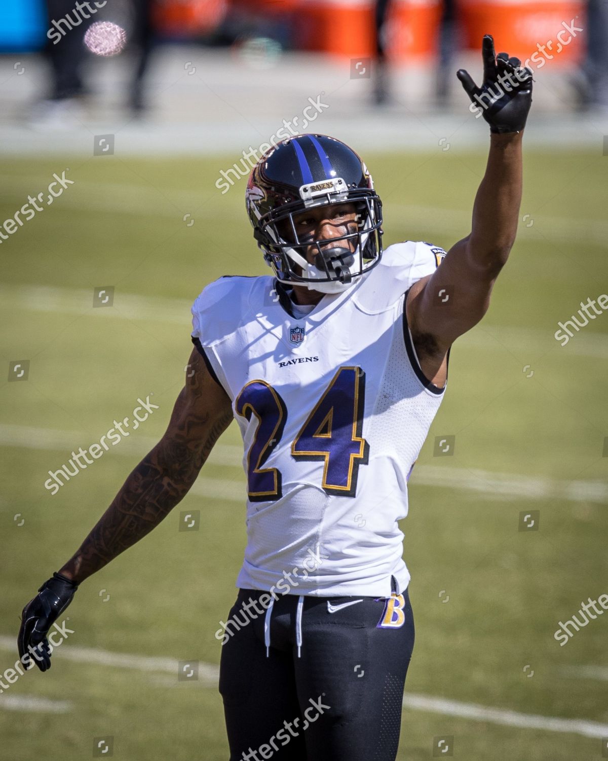 Baltimore Ravens cornerback Marcus Peters (24) reacts to a play