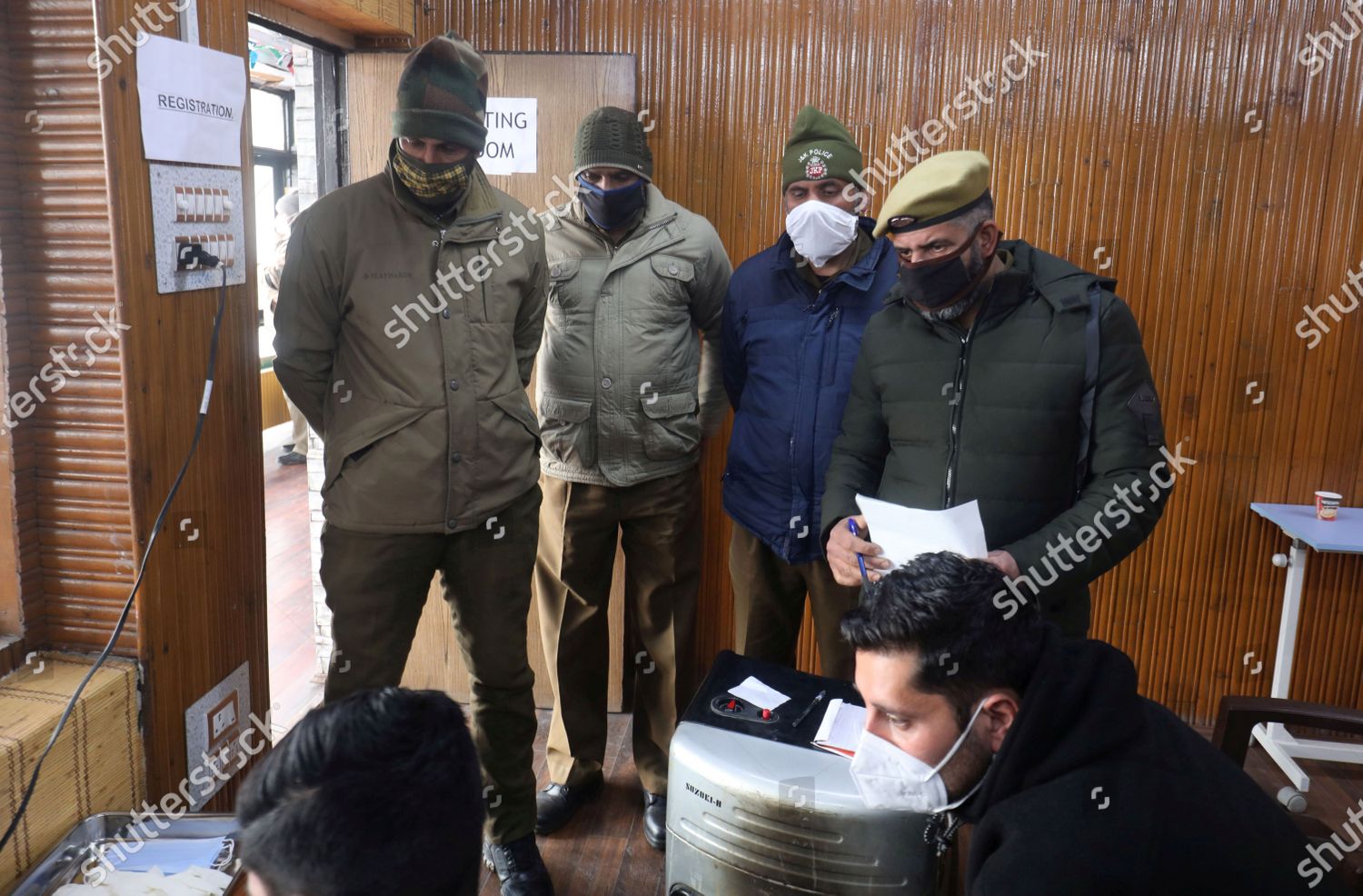 INDIAN POLICEMEN CHECK THEIR DETAILS BEFORE Editorial Stock Photo