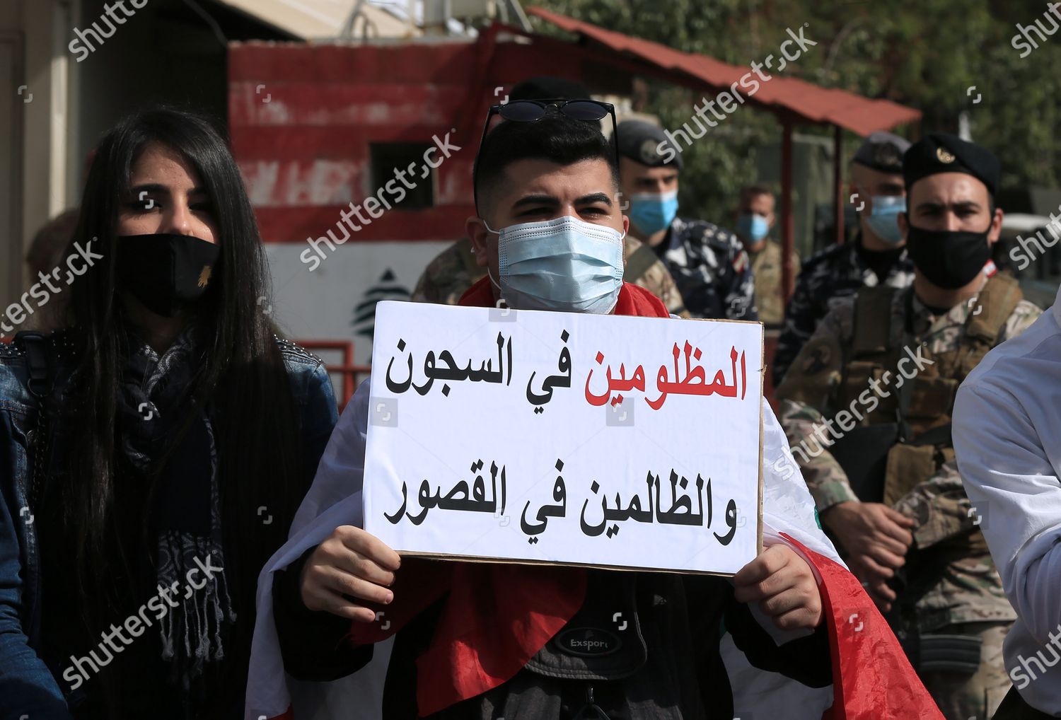 Antigovernment Protester Holds Placard Reading Arabic Editorial Stock ...