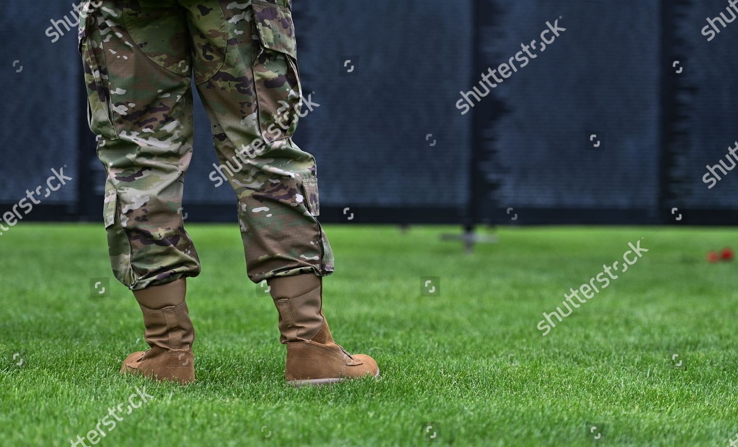 man-wearing-military-fatigues-looks-wall-editorial-stock-photo-stock