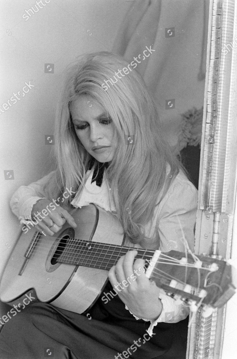 Actress Brigitte Bardot Playing Guitar While Editorial Stock Photo ...