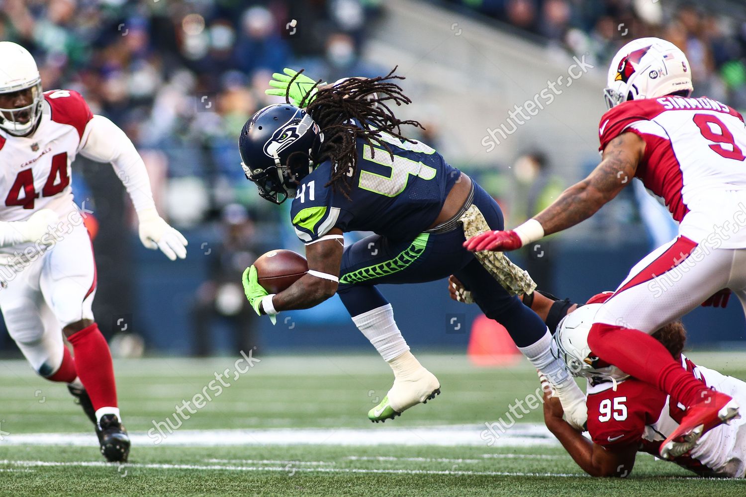 Arizona Cardinals defensive tackle Leki Fotu (95) looks up at a