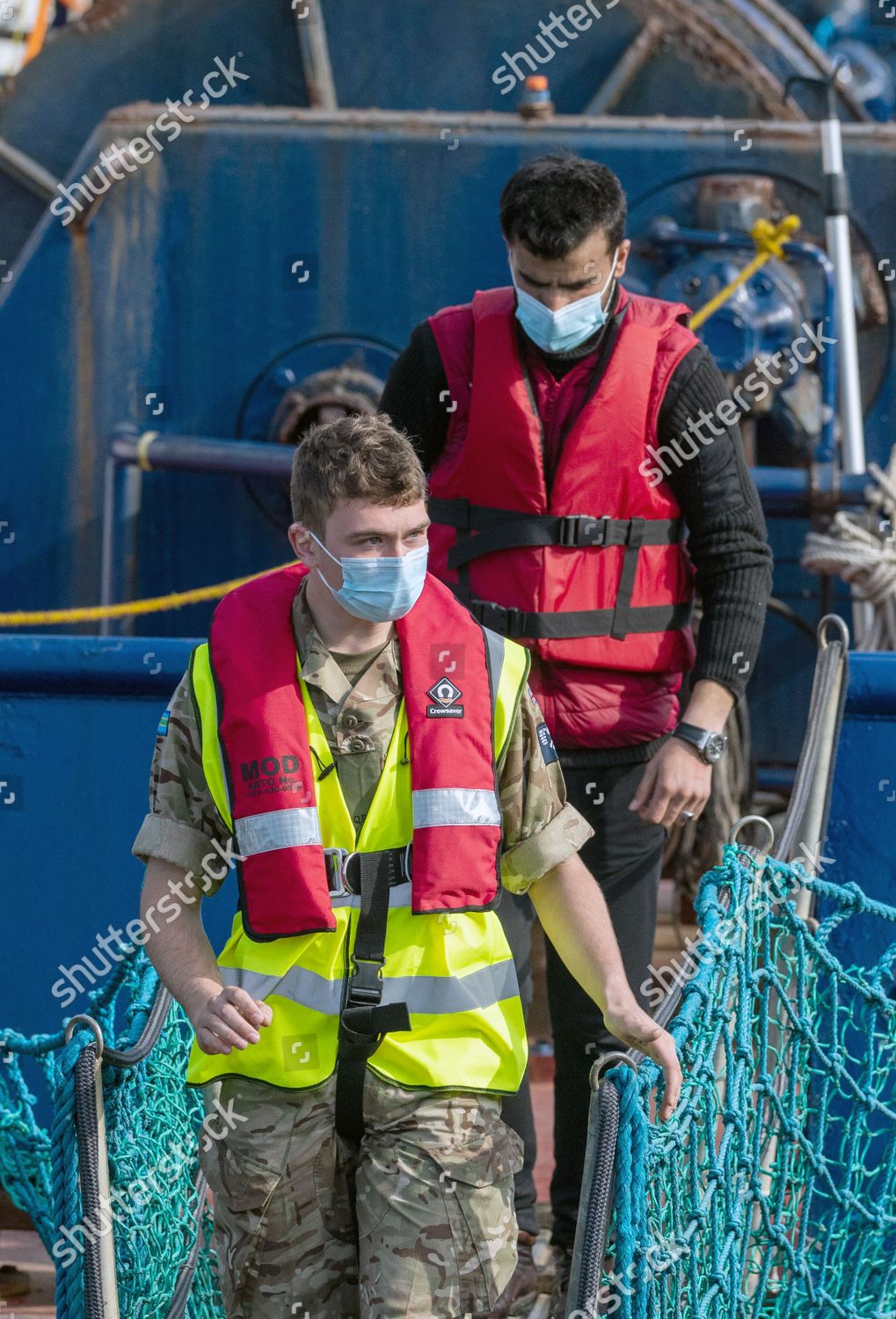 migrants-escorted-by-border-force-officers-editorial-stock-photo