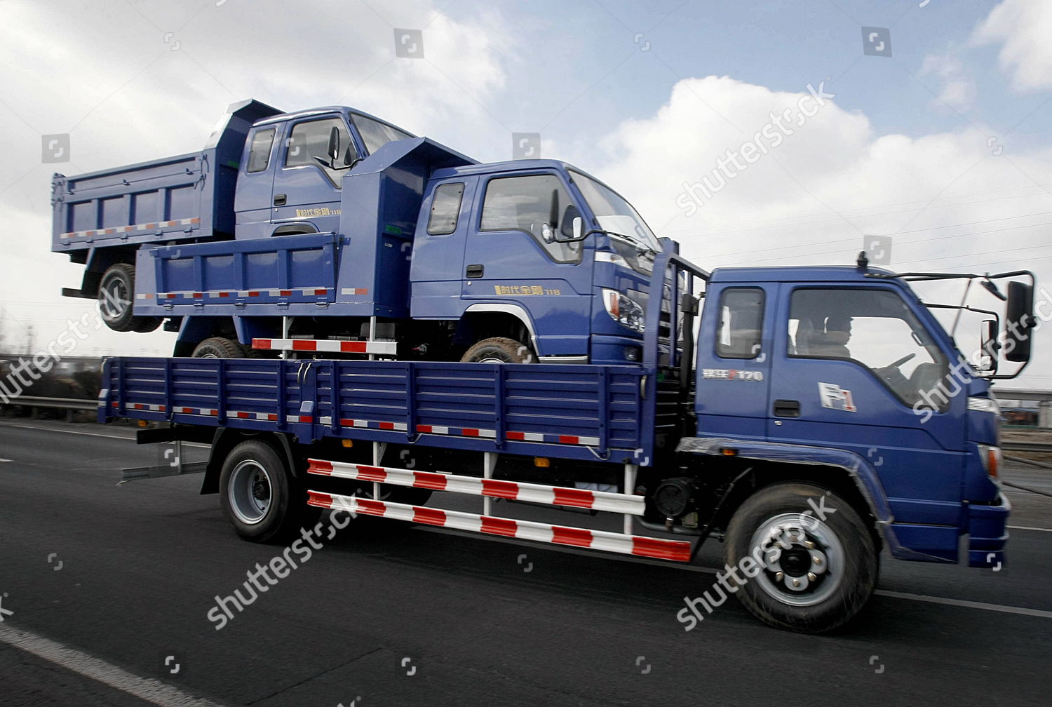 truck-driving-along-road-while-carrying-editorial-stock-photo-stock