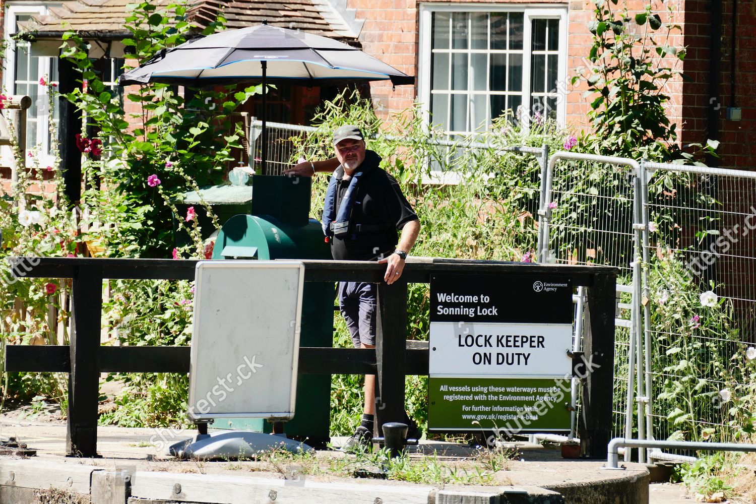 Sonning Lock Keeper Under Umbrella Editorial Stock Photo Stock Image
