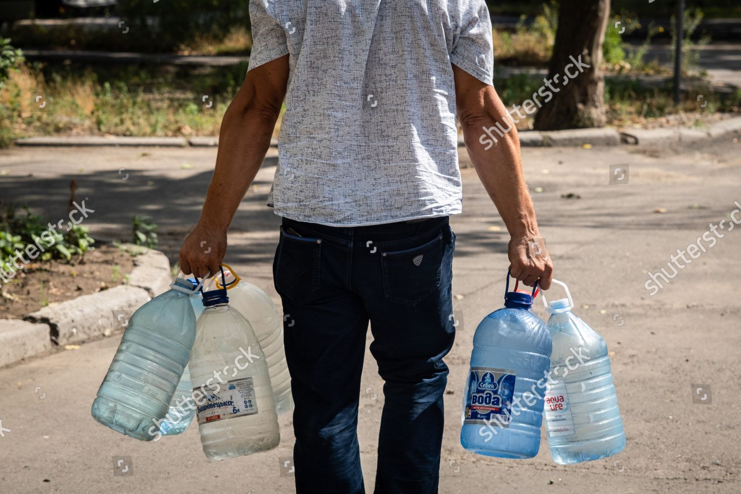 Man Seen Carrying Bottles Full Water Editorial Stock Photo - Stock