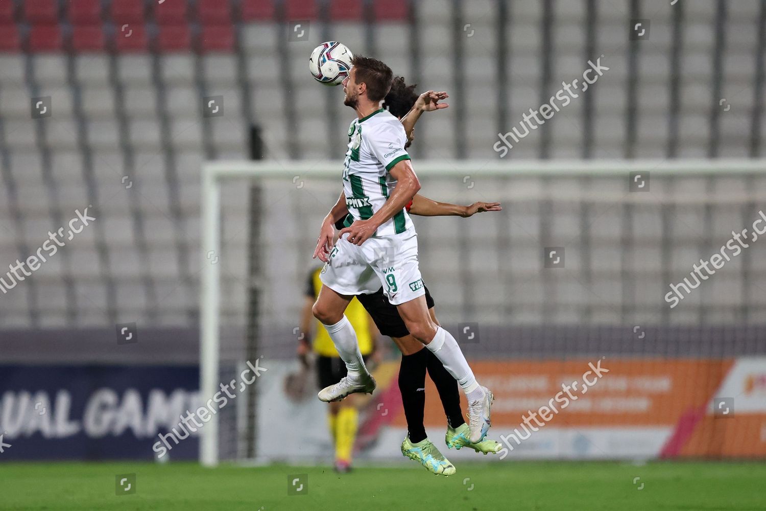 Barnabas Varga of Ferencvarosi TC shoots on goal beside Marcelina News  Photo - Getty Images