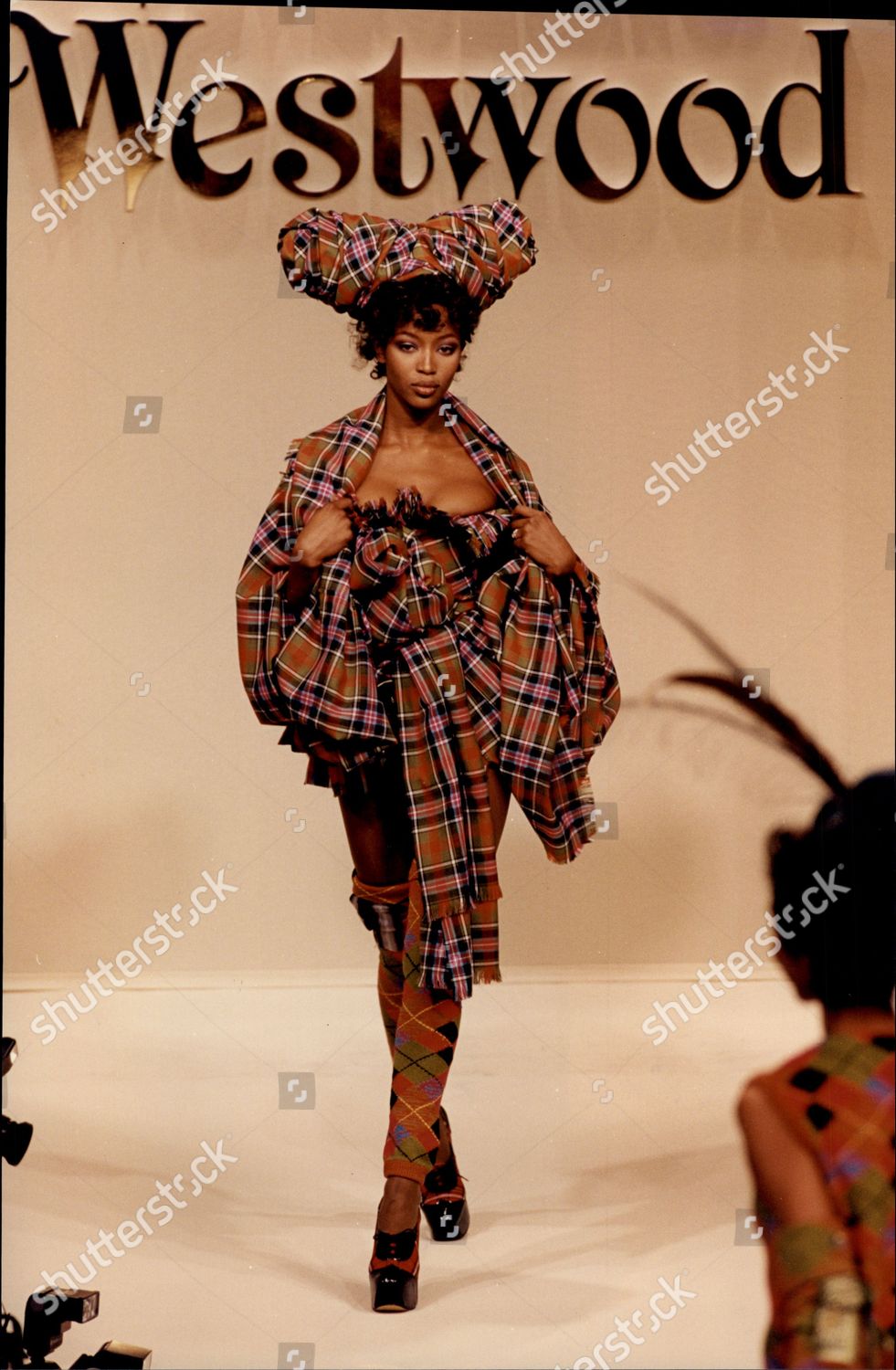 Naomi Campbell in a tartan ensemble for Vivienne Westwood's Fall/ Winter  1994 “On Liberty” collection. #viviennewestwood…