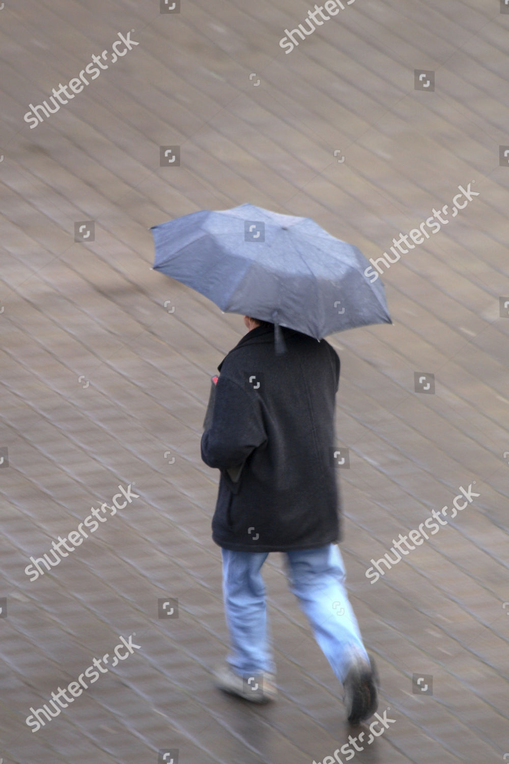 Man Walking Through Rain Editorial Stock Photo - Stock Image | Shutterstock