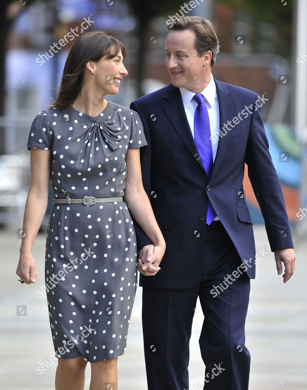 david-and-samantha-cameron-sam-cams-wardrobe-has-been-chosen-with-pr-in-mind-for-her-husbands-big-day-she-wore-a-a65-dove-grey-and-white-polka-dot-1940s-inspired-tea-dress-from-marks-spencer-the-dress-sold-out-in-june-after-becoming-one-of-m-shutterstock-editorial-1954092a.jpg