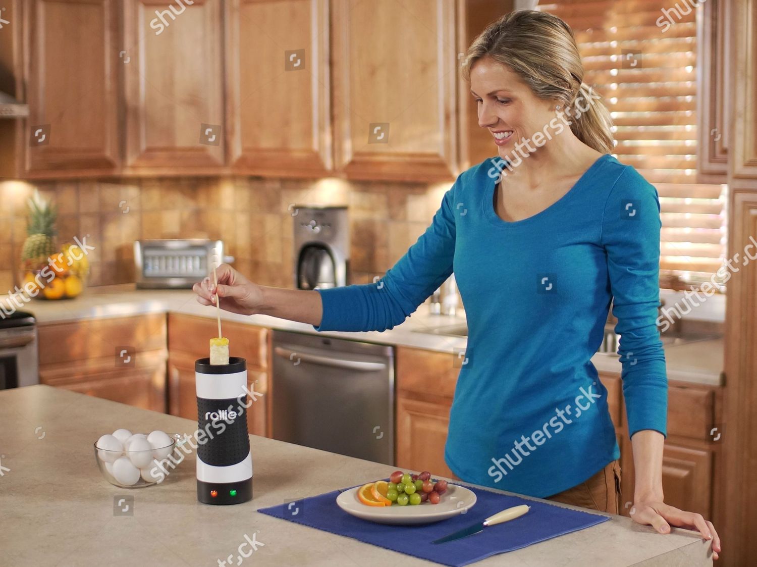 Woman Using Rollie Eggmaster Editorial Stock Photo - Stock Image