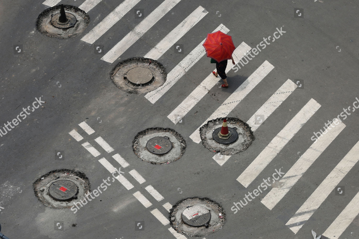 Pedestrian Navigates Round Manhole Potholes Editorial Stock Photo   Shutterstock 3836501e 